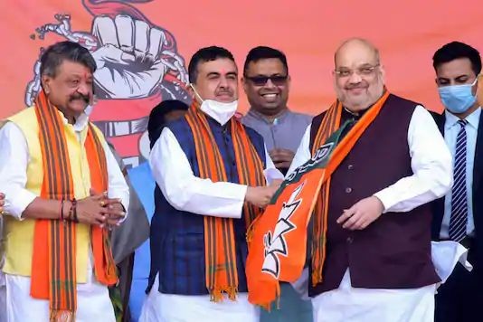 Union home minister Amit Shah with Suvendu Adhikari at a rally in West Midnapore district on December 19, 2020. (PTI Photo)